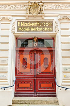 Historic house entrance of a furniture workshop in Stralsund, Germany