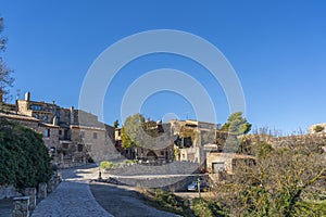 Historic houses in the center of mountain village Siurana with blue sky, Tarragona