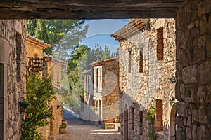 Historic houses in the center of mountain village Siurana with blue sky, Tarragona