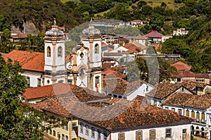 Historic houses and churches among the hills and vegetation