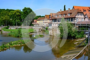 Historic houses, tower of city wall and ancient bridge in Schwabisch Hall, Germany
