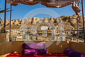 Historic Jaisalmer Fort with city buildings as seen from a hotel rooftop at Jaisalmer, Rajasthan, India