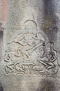 Historic Khmer bas-relief showing dancing Hindu godesses at Bayon temple