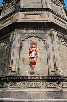 Historic Maheshwar Fort with stone carved walls having Lord Hanuman Idol