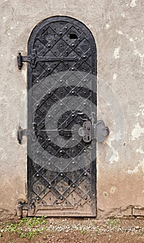 Historic metal door with dirty footing