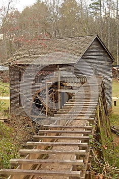 Historic mill with waterwheel photo