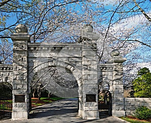 Historic Oakwood cemetery entrance and Spring trees in bloom in Raleigh North Carolina