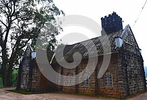 Historic Old Church Building made of Stones and a Huge Tree - Muunar, Kerala, India