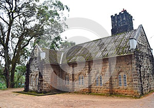 Historic Old Church Building made of Stones and a Huge Tree - Muunar, Kerala, India