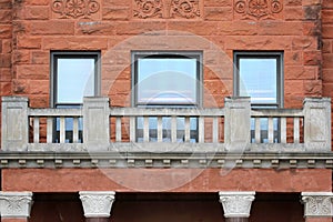 Historic Old Red Sandstone Building Windows Brick and Balcony