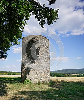 Historic old stone circular tower ruin in a scenic landscape in Hunsruck, Germany photo