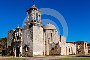 The Historic Old West Spanish Mission San Jose, Founded in 1720, San Antonio, Texas, USA. Showing dome, bell tower, and one of t