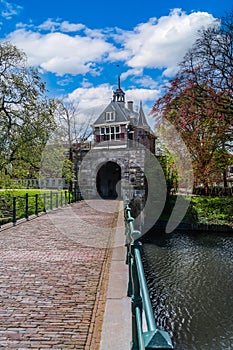 Historic oosterpoort city gate with stone arch bridge in Hoorn, Netherlands in spring photo
