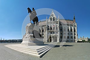 Historic parliament building with statue of Gyul AndrÃ¡ssa in Budapest