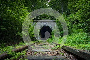 Historic railway tunnel under the mountain. Former German engineering constructio