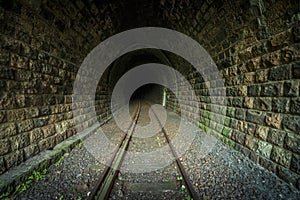 Historic railway tunnel under the mountain. Former German engineering construction. Likely hiding place of the Nazis gold train