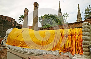 Historic Reclining Buddha Image in the Temple Ruins with the Stupas in Backdrop, Wat Yai Chai Mongkhon Temple, Ayutthaya, Thailand