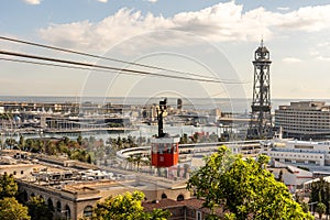 historic red cable car cabin with harbor and panorama of Barcelona city, spain