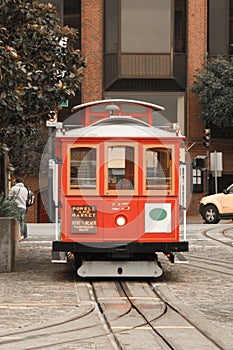 Historic red cable car in Friedel Klussmann Memorial Turnaround, Fisherman`s wharf, San Francisco, California, United States of