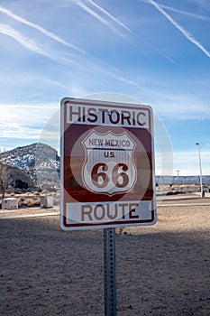 Historic Route 66 road sign in New Mexico against an overcast sky