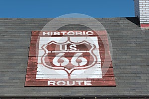 Historic Route 66 sign on a roof in Winslow