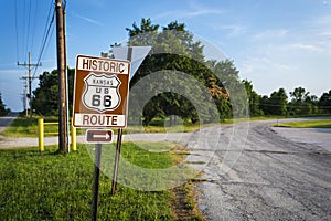 Historic Route 66 road sign in a stretch of the original road in the State of Kansas, USA