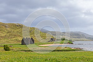 The historic ruins of Calda House, a solemn figure in the Highland Council, amidst Scotland\'s rugged hills