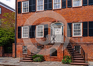 Historic Savannah Brick Townhouse with Wrought Iron Staircase and Shutters, a Classic Southern Architecture Gem Savannah