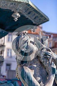 Historic sculpture of a mermaid in the fountain at Rossi Square