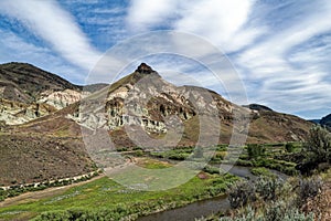 Historic Sheep Rock towers over the John Day River at the John Day Fossil Beds National Monument, Oregon, USA