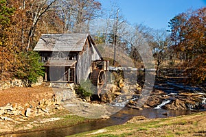 Historic Sixes Mill from the 1800s in Canton, Georgia, during autumn