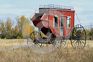 Historic Stage Coach sits in a field