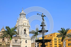 Historic Statue of Angel of the Fame on the Fountain at Plaza Mayor with Basilica Cathedral of Lima in the Backdrop, Lima, Peru