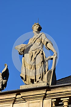 Historic statue on top of the fassade of Margrave Opera House in Bayreuth, Germany