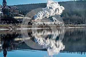 Historic steam locomotive at the exit from the station Schluchsee