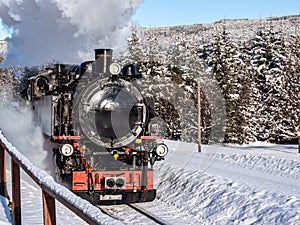 Historic steam locomotive in the wintry Ore Mountains