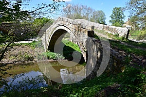 Historic Stone Beggar`s Bridge Over the River Esk