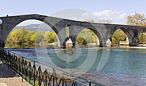 Historic stone bridge of Arta at west Greece photo