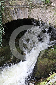 Historic Stone Bridge and Stock Beck River, Ambleside, Cumbria, England, UK