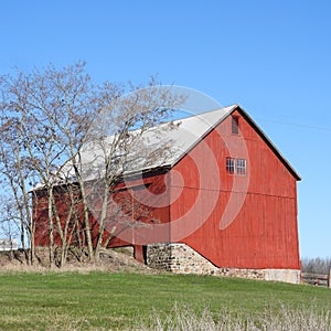 Historic NYS stone foundation red paint wood agriculture barn photo