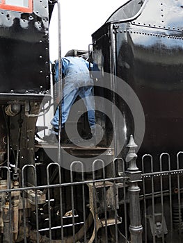 Historic Strasburg Railroad train engineer prepping coal car