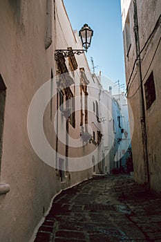 Historic Street in Ostuni with Old Stone Floor and Vintage Lamp