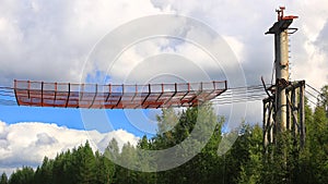 Historic support of Norsjoe ropeway in northern Sweden with safety net above street