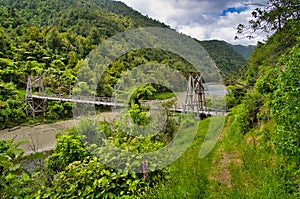 The historic Tauranga Bridge, a suspension bridge spanning the Waioeka River, New Zealand