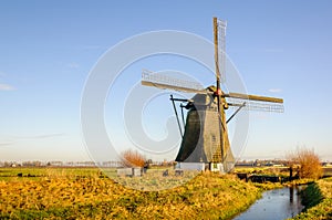 Historic thatched windmill in a Dutch polder