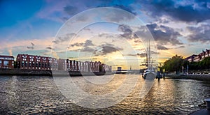 Historic town of Bremen with Weser river with dramatic clouds at photo