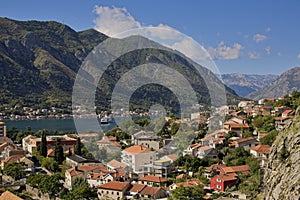 The historic town of Kotor, Montenegro, unfolds along the shores of the Adriatic, embraced by dramatic mountains and the tranquil