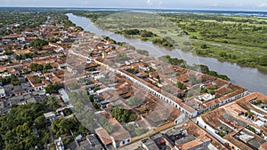 Aerial view of the historic town Santa Cruz de Mompox in sunlight with river and green sourrounding, World Heritage photo