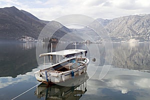 Historic town on the sea with islands mountains and boat