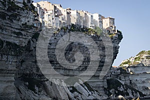 Historic town on a white cliff overlooking the sea in the port of Bonifacio